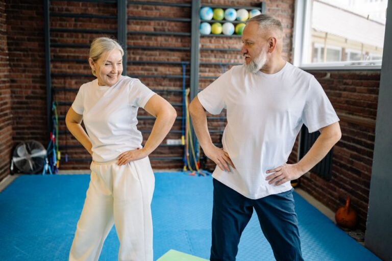 Older adults doing balance exercises in a gym
